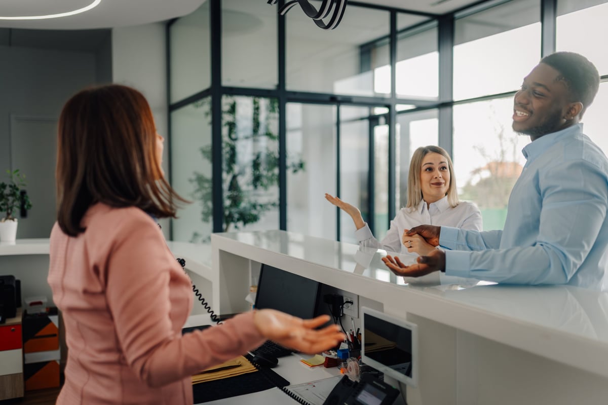 Diverse professionals at a modern office reception
