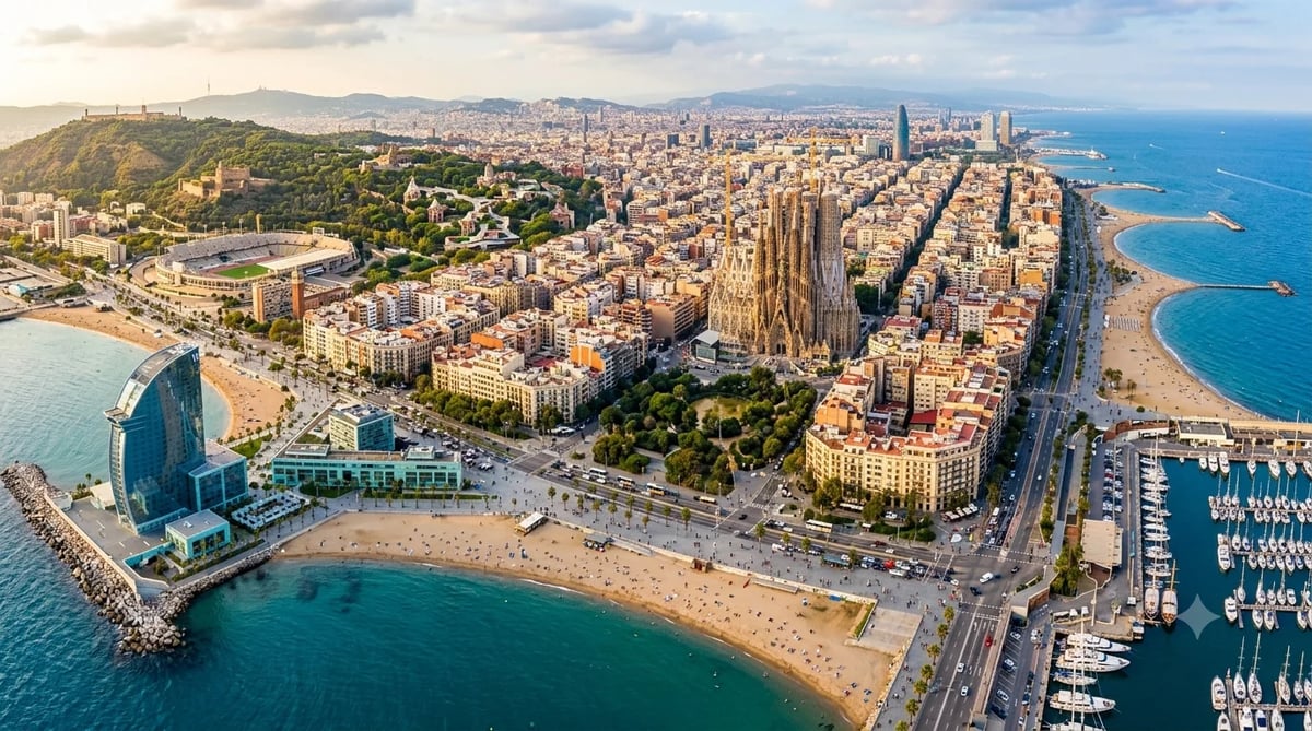 Aerial view of Barcelona coastal cityscape with Sagrada Familia, beach, marina, and Mediterranean Sea