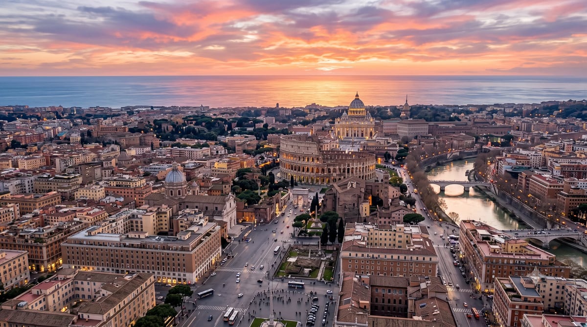 Aerial view of Rome at sunset with St. Peter's Basilica, the Colosseum, and the Tiber River winding through the city